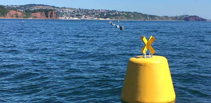 Yellow NN1100 buoy manufactured by Norfloat International for shellfish farm